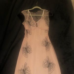 Mid length dress. Never been worn.